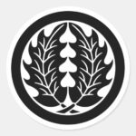 Two symmetrical holly leaves with round as Family crests Sticker