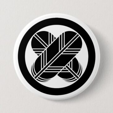 Crossed hawk feathers with circle as Japanese Family crests Button