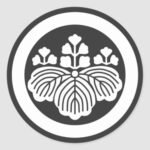 A circle inside 3 5 Paulownia flowers with leaf for Kamon Round Sticker