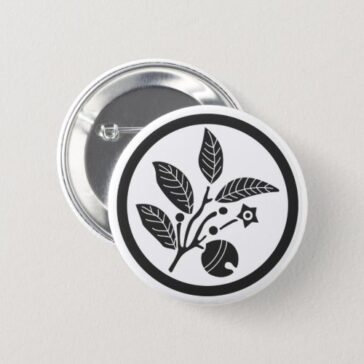 A circle inside Cleyera japonica and a bell for family crests Pinback Button
