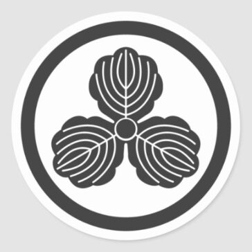 3 oak leaves inside a circle for family crests Sticker