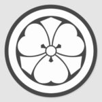 a circle inside Oxalis corniculata with swords for family crests Round Sticker