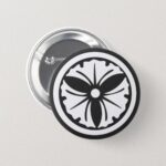 a circle inside 3 ginkgo leaves for family crests pinback button
